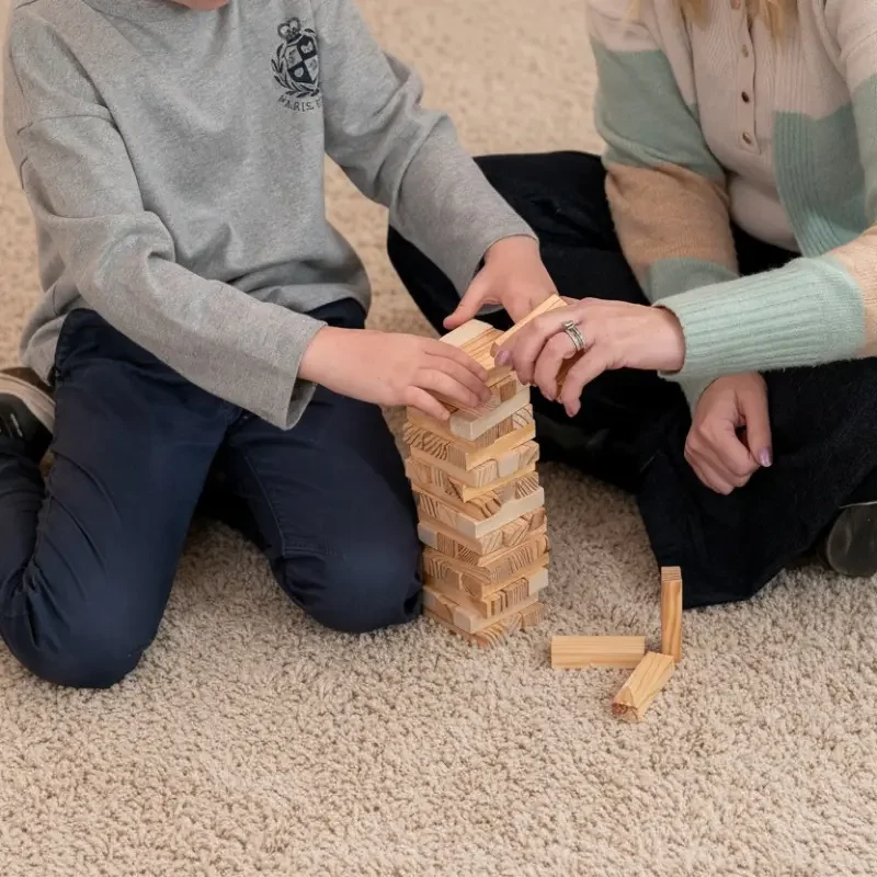 Close-up of Jenga blocks, symbolising education support services that build learning step by step for Melbourne families.