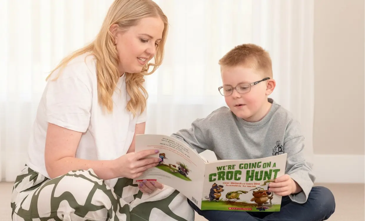 Take home reading-guide for parents. Image of mother reading with son